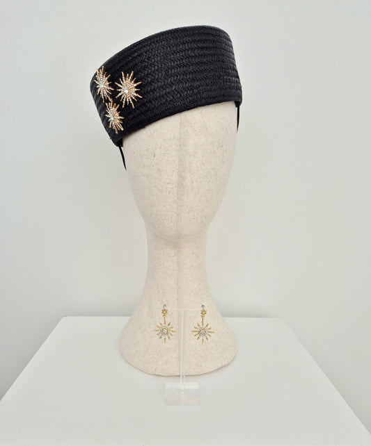black straw headpiece pillbox with gold star detail and matching earings