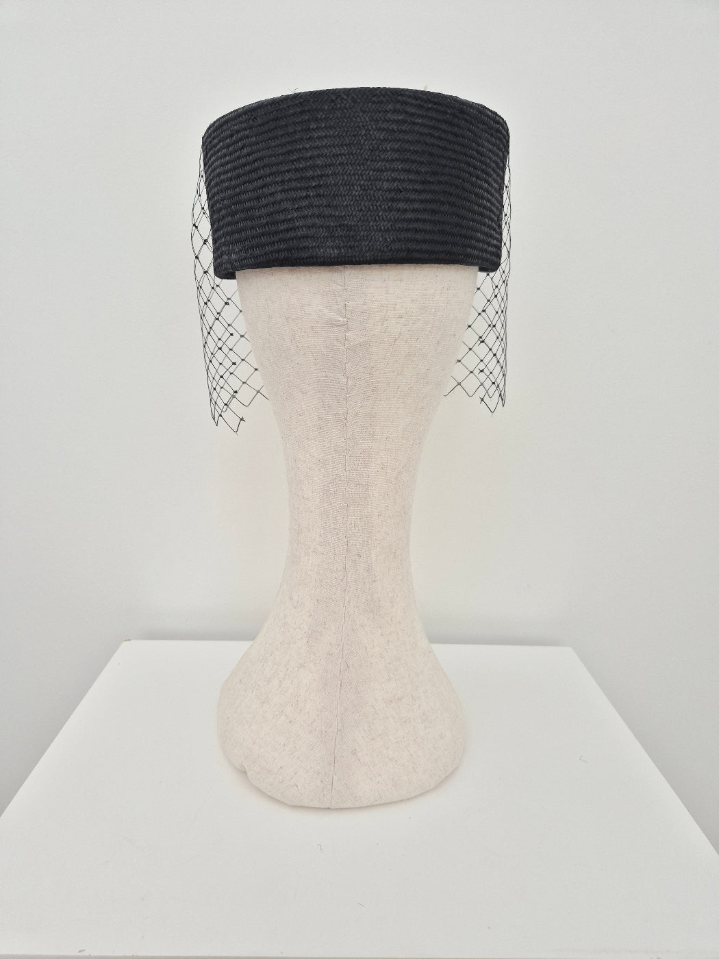black straw pillbox with veiling back view