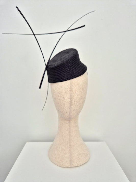 black straw slanted headpiece with quills