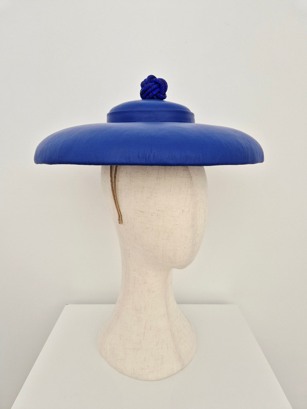 blue leather hat with rhinestone ball side view