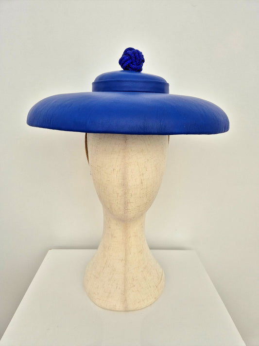 blue leather hat with rhinestone ball