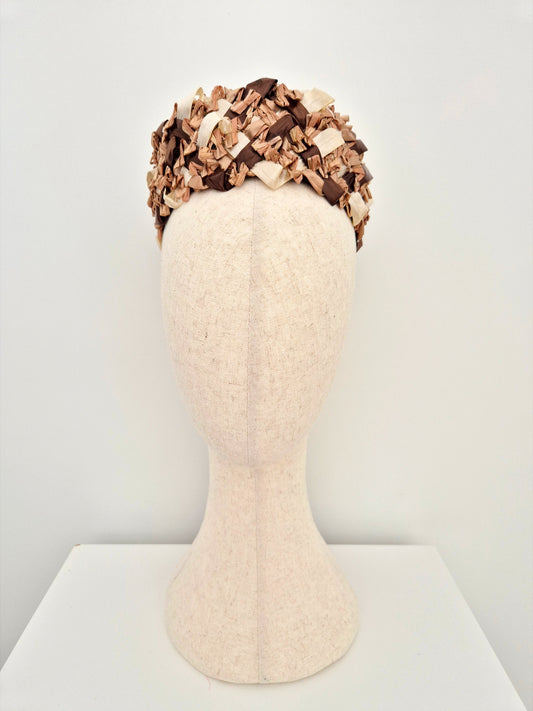 brown and cream straw rear sitting pillbox headpiece