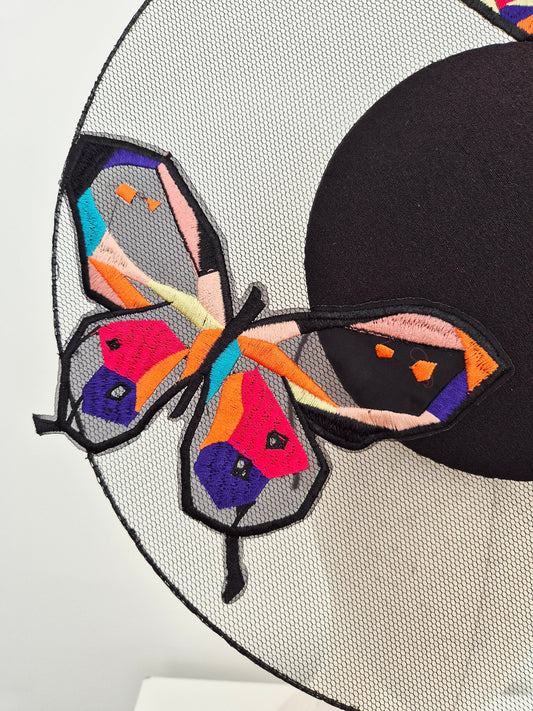close up back percher with butterfly detail