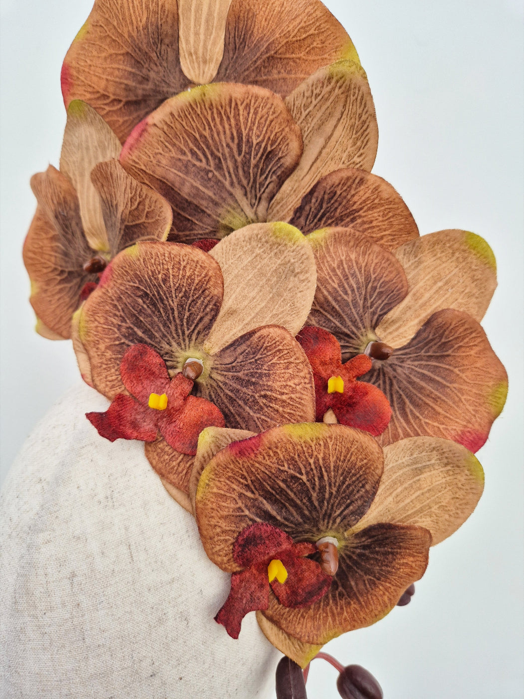 close up of brown tonal orchid headpiece
