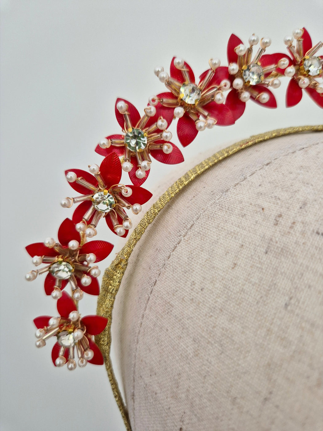 close up gold and red floral headband