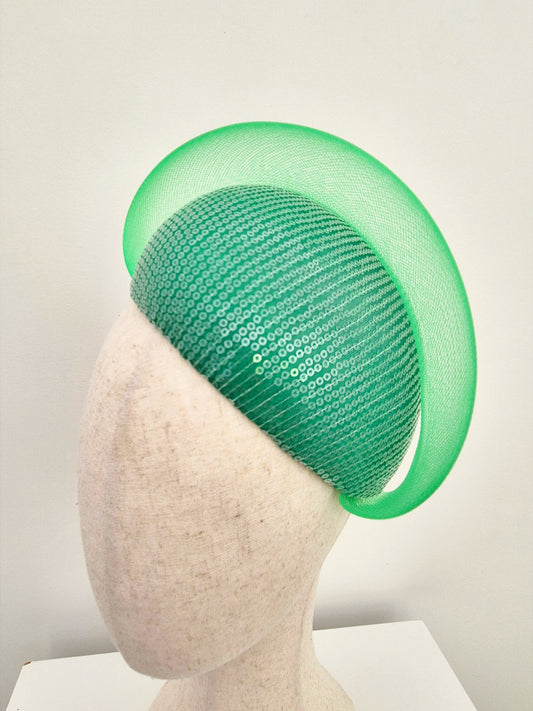 close up of green sequin headpiece 