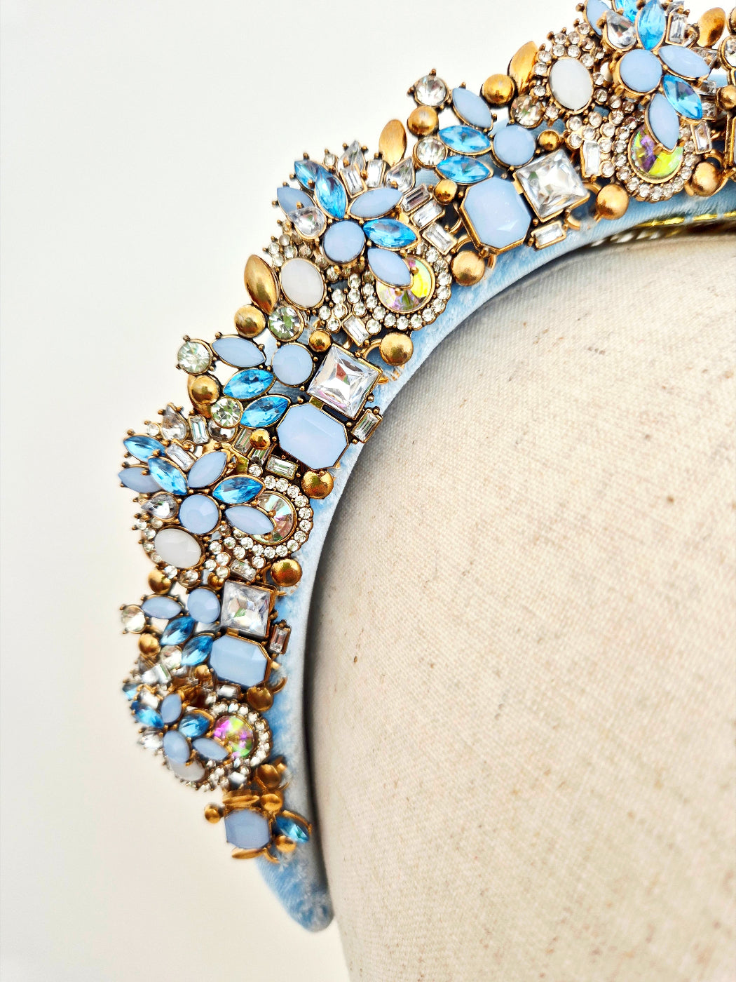 close up light blue headband with rhinestones