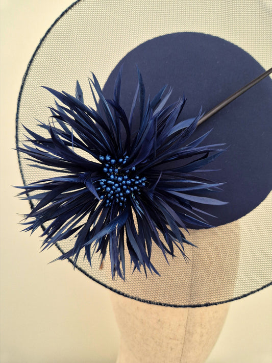close up navy blue percher with flower