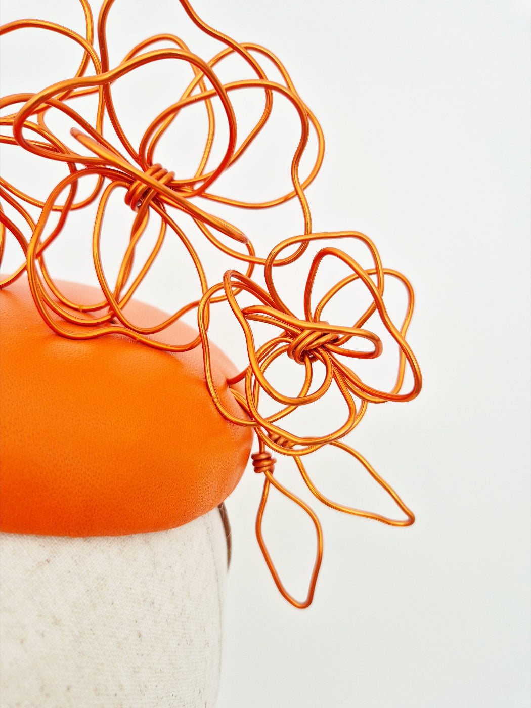 close up orange floral wirework