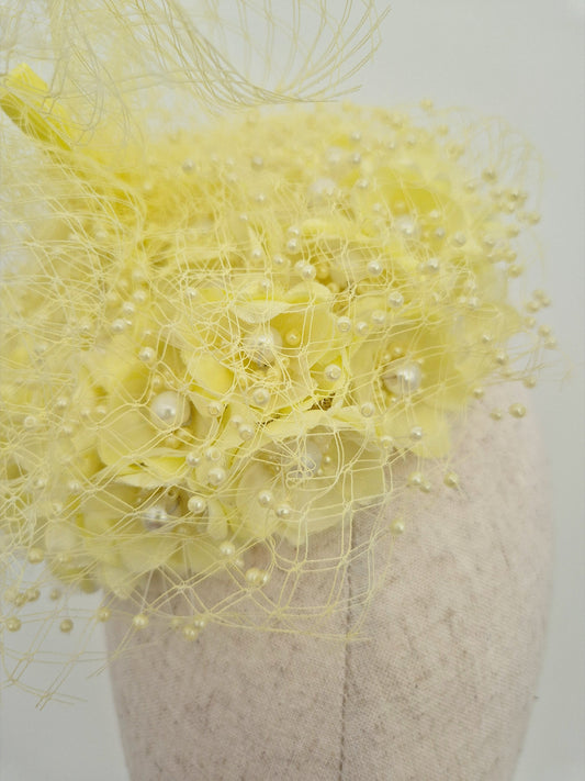 close up 3d pale yellow floral headpiece