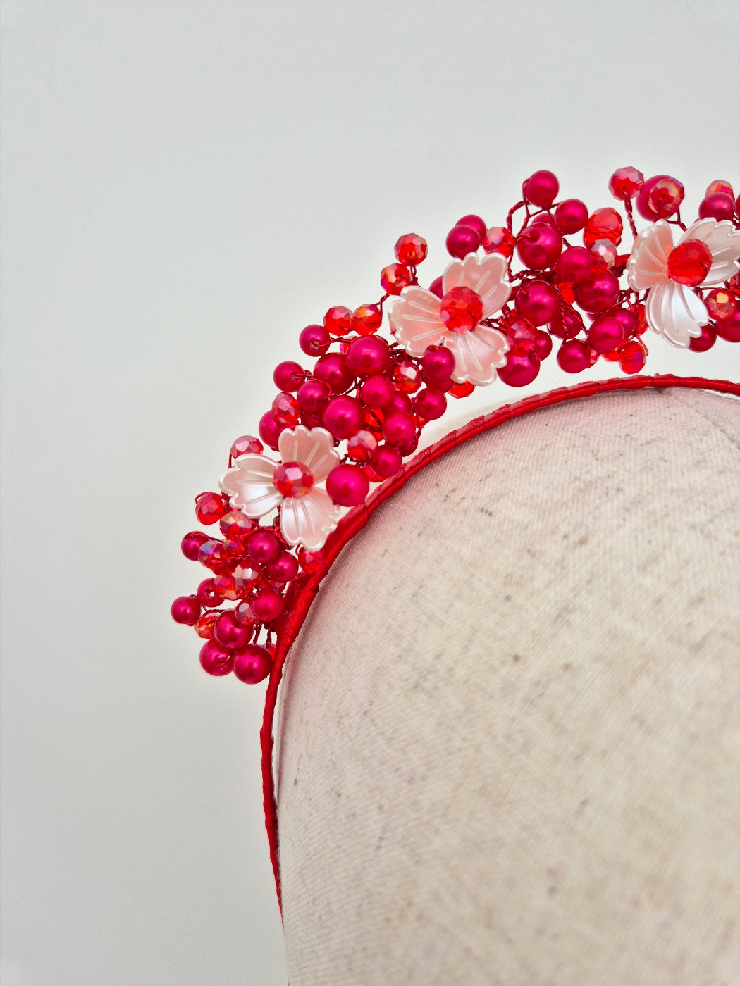 close up red pearl headpiece