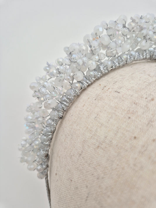 close up white and silver crystal headband
