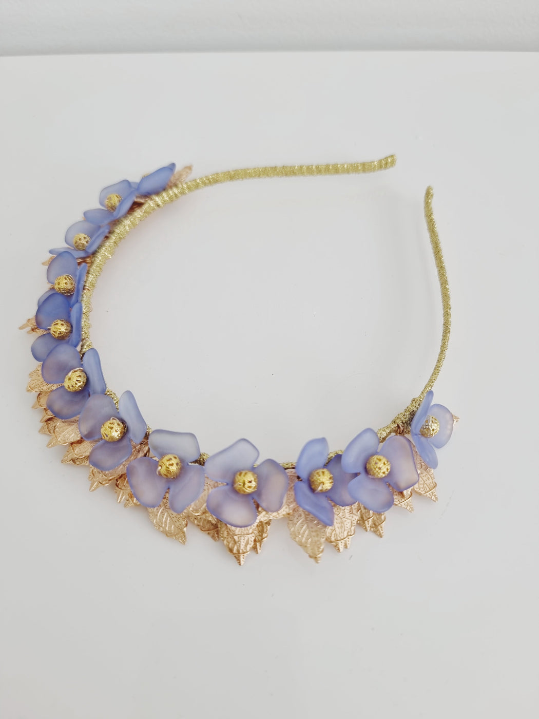 dusty blue and gold floral headpiece flat lay