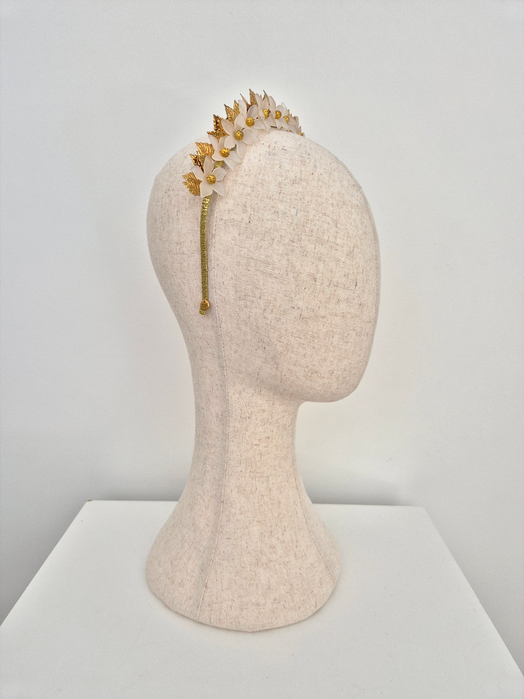 gold and white floral crown side view