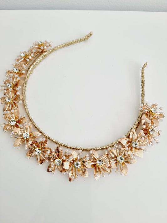 gold flower headpiece flat lay