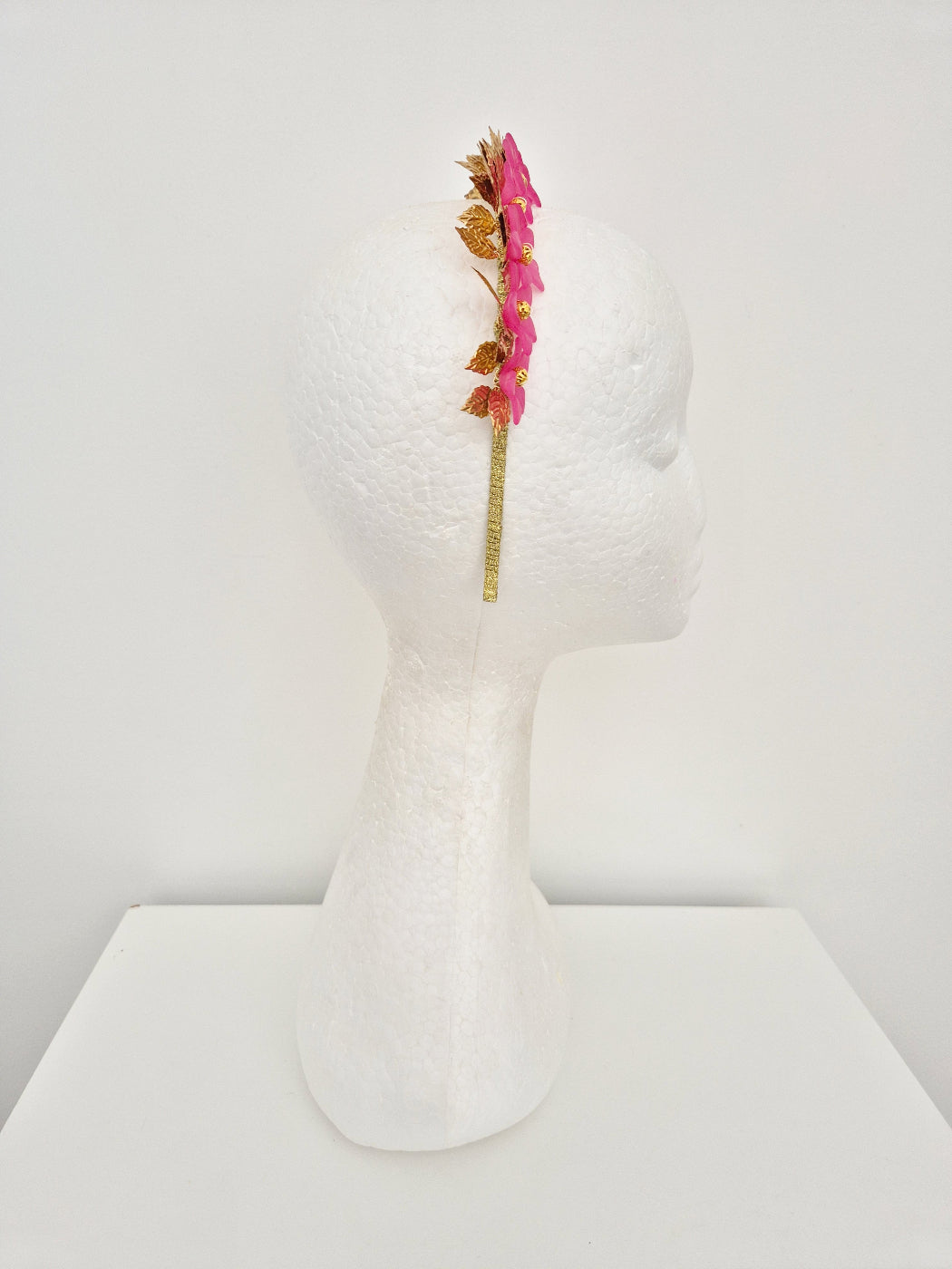 gold leaf and pink flower crown side view