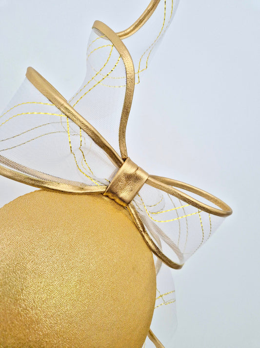 gold percher with bow close up
