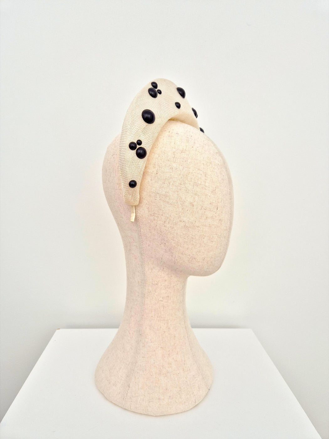 ivory straw halo headpiece with black pearls side view