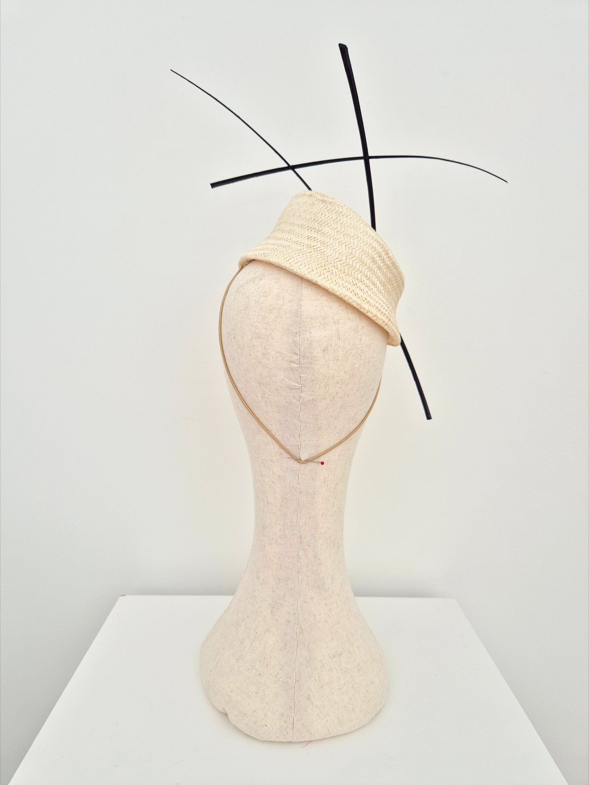 ivory straw slanted base headpiece with black quills back view