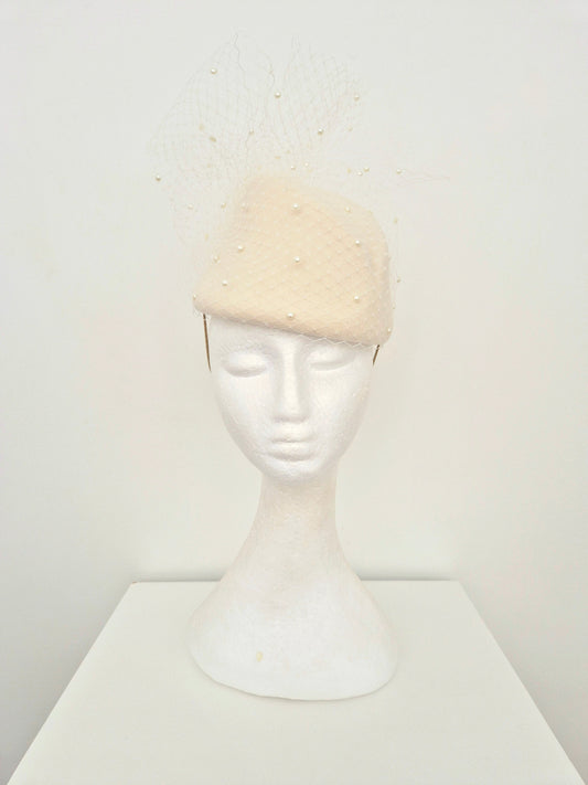 ivory wool topper headpiece with veiling and pearls