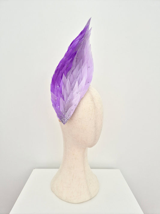 lilac ombre feathered headpiece on a mannequin head against a white background side view