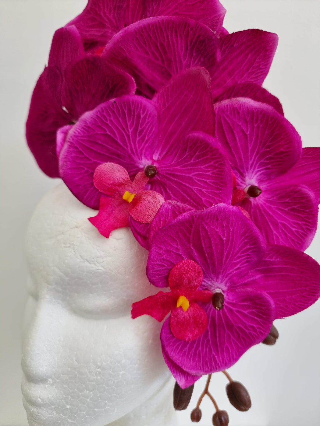 magenta orchid headpiece close up