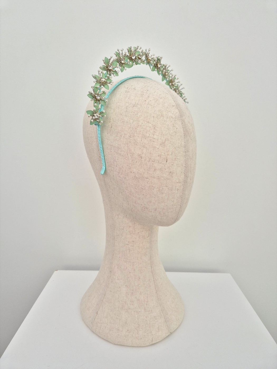 mint green and silver floral headband side view