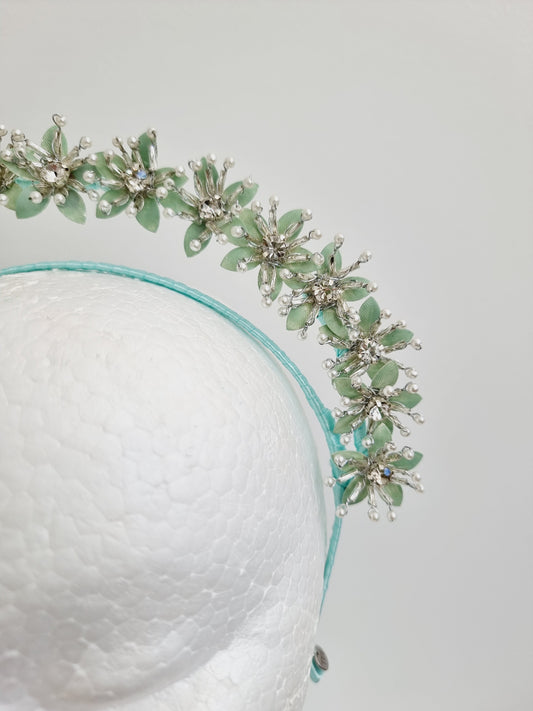 mint green flower headpiece close up