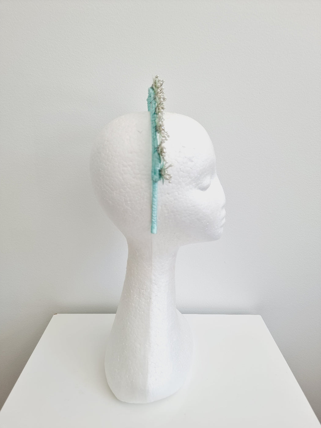 mint green flower headpiece side view