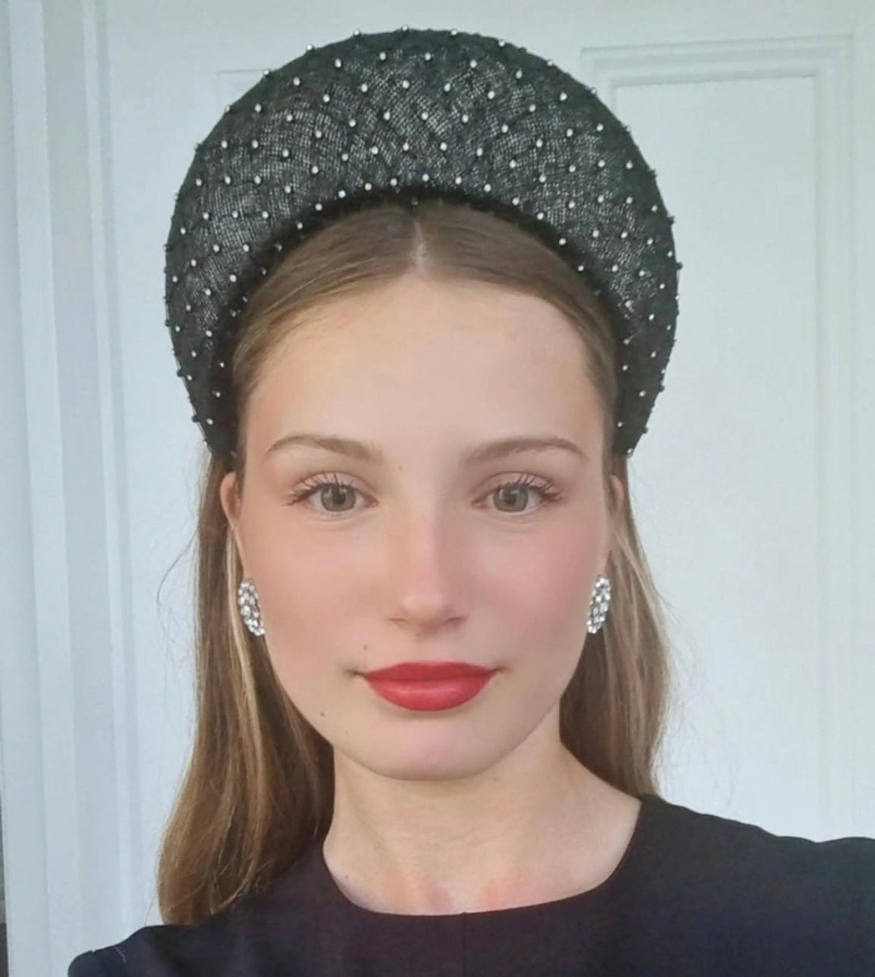 model wearing a silver straw rhinestone halo headpiece