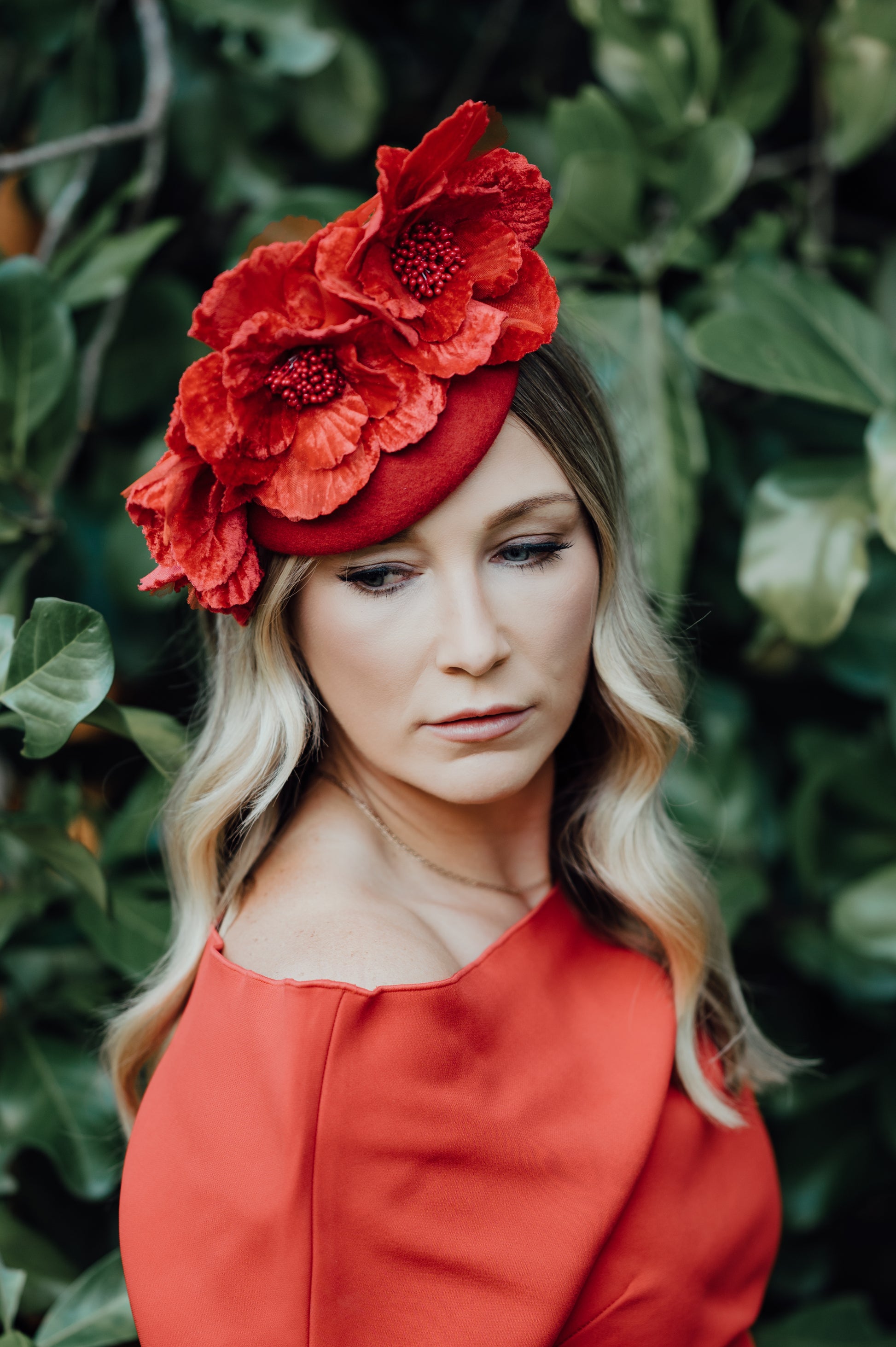 model wearing floral headpiece in a garden