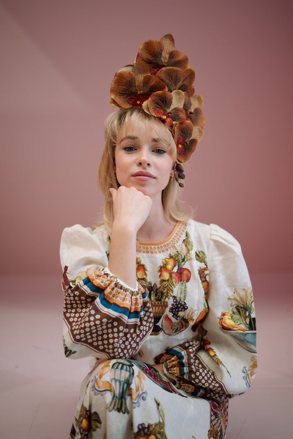 model wearing orchid headpiece