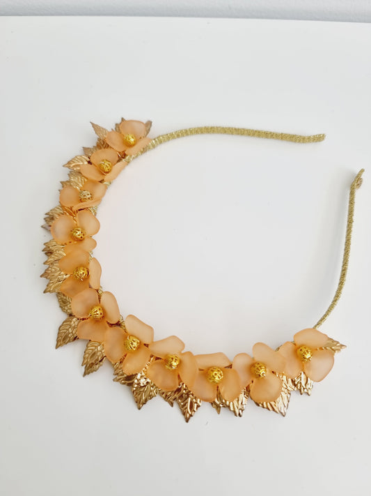 orange and gold floral headband flat lay