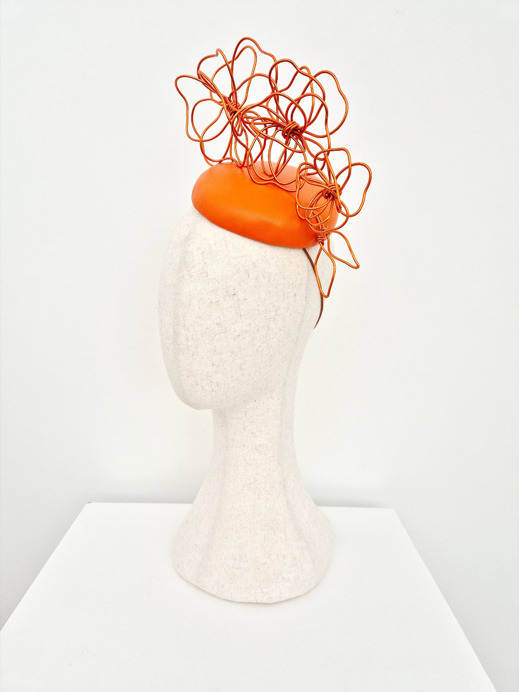 orange button base with floral wirework side view