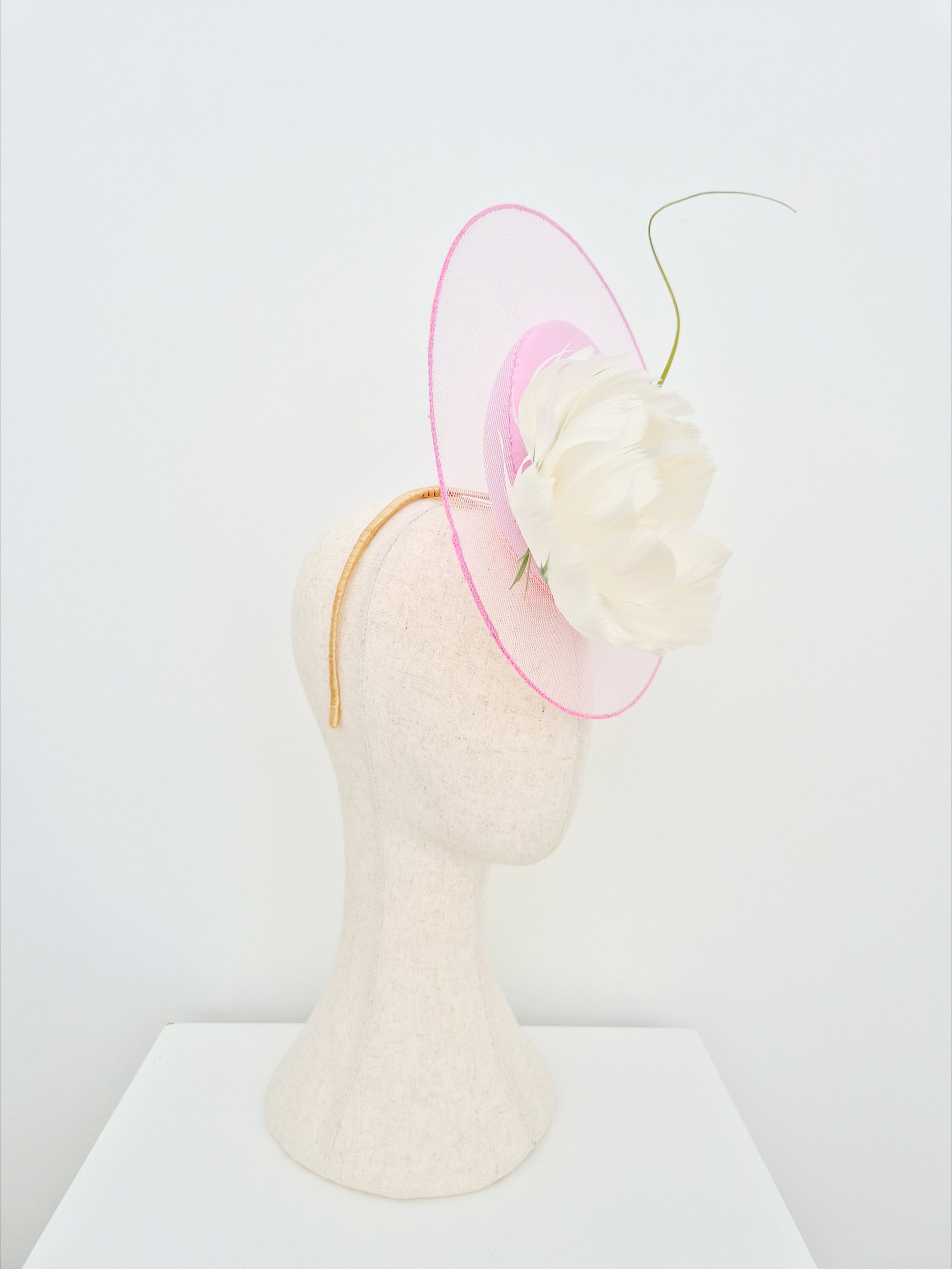 pink percher headpiece with feather flower side view
