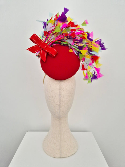 red percher headpiece with multi coloured feathers