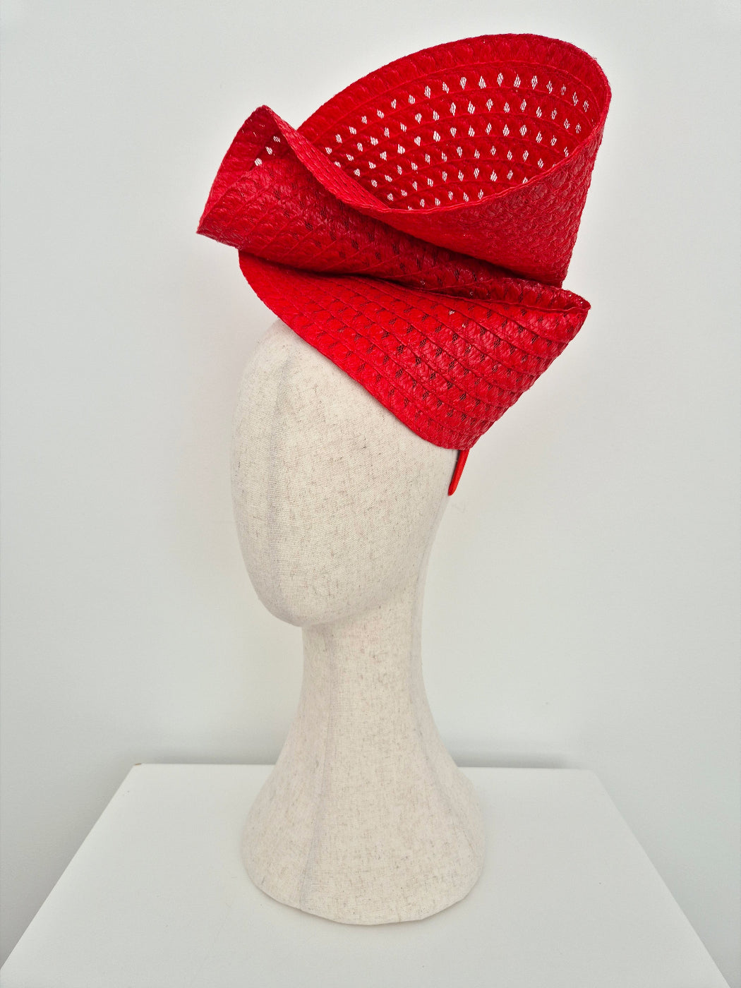 red straw headpiece side view