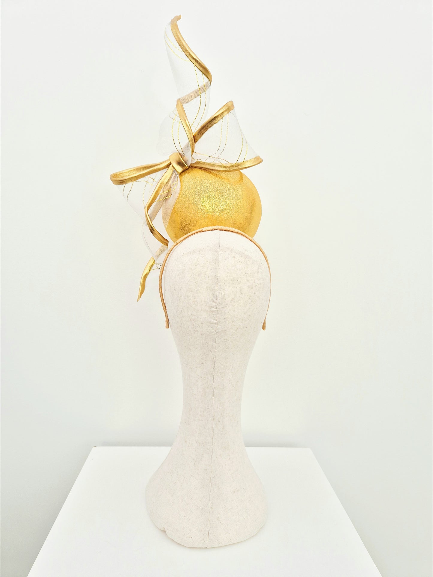 Miss Gwyneth. Womens Gold button percher headpiece with crinoline bow swirl