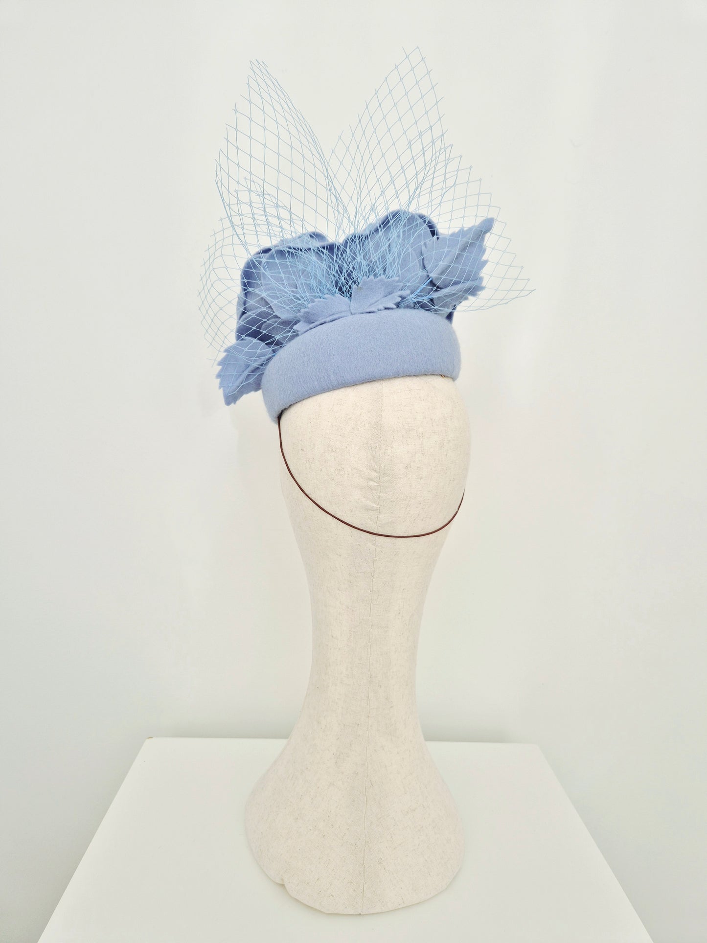 Miss Laura. Womens Dusty Blue felt slanted pillbox headpiece with roses and veiling