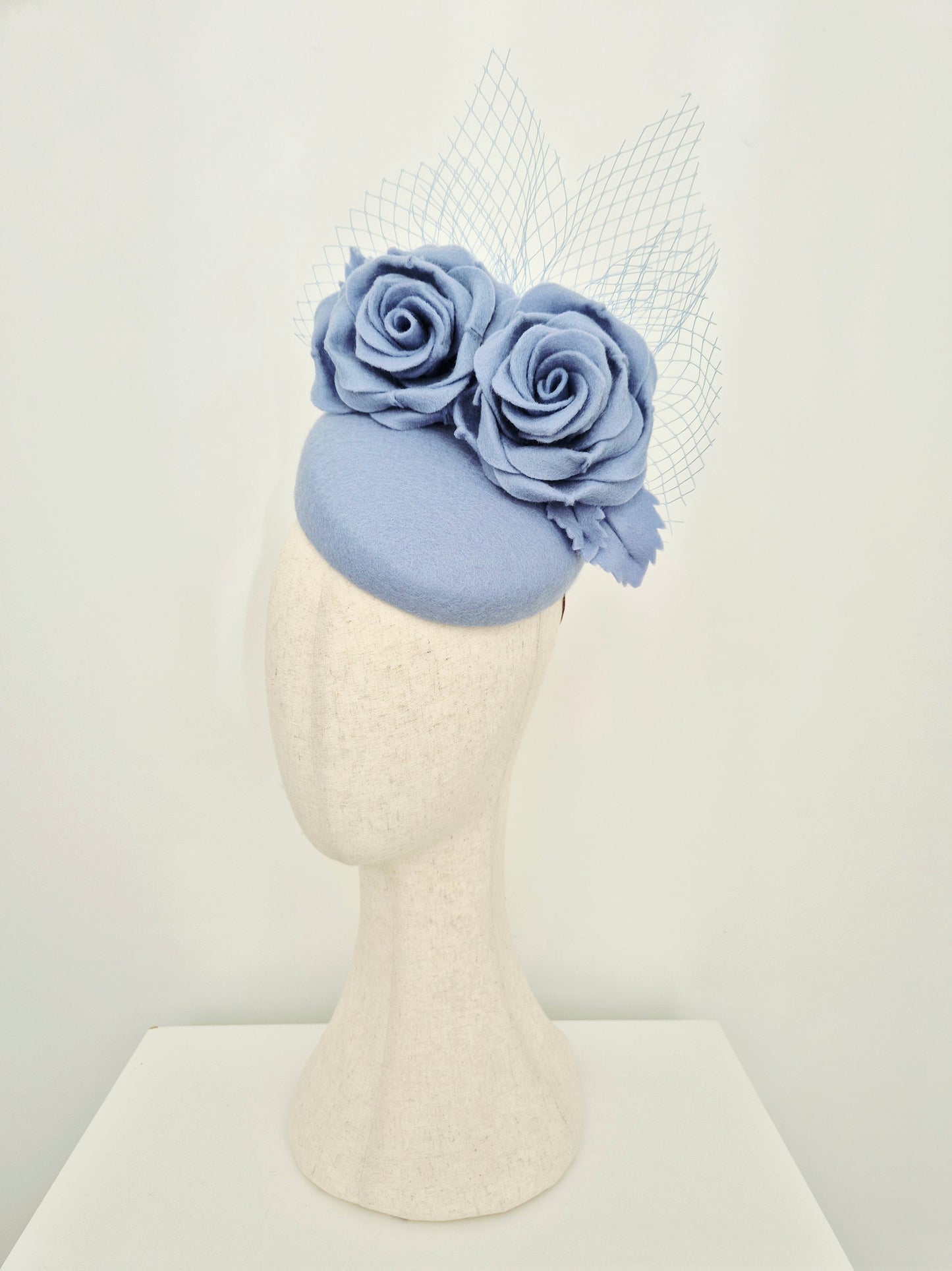 Miss Laura. Womens Dusty Blue felt slanted pillbox headpiece with roses and veiling