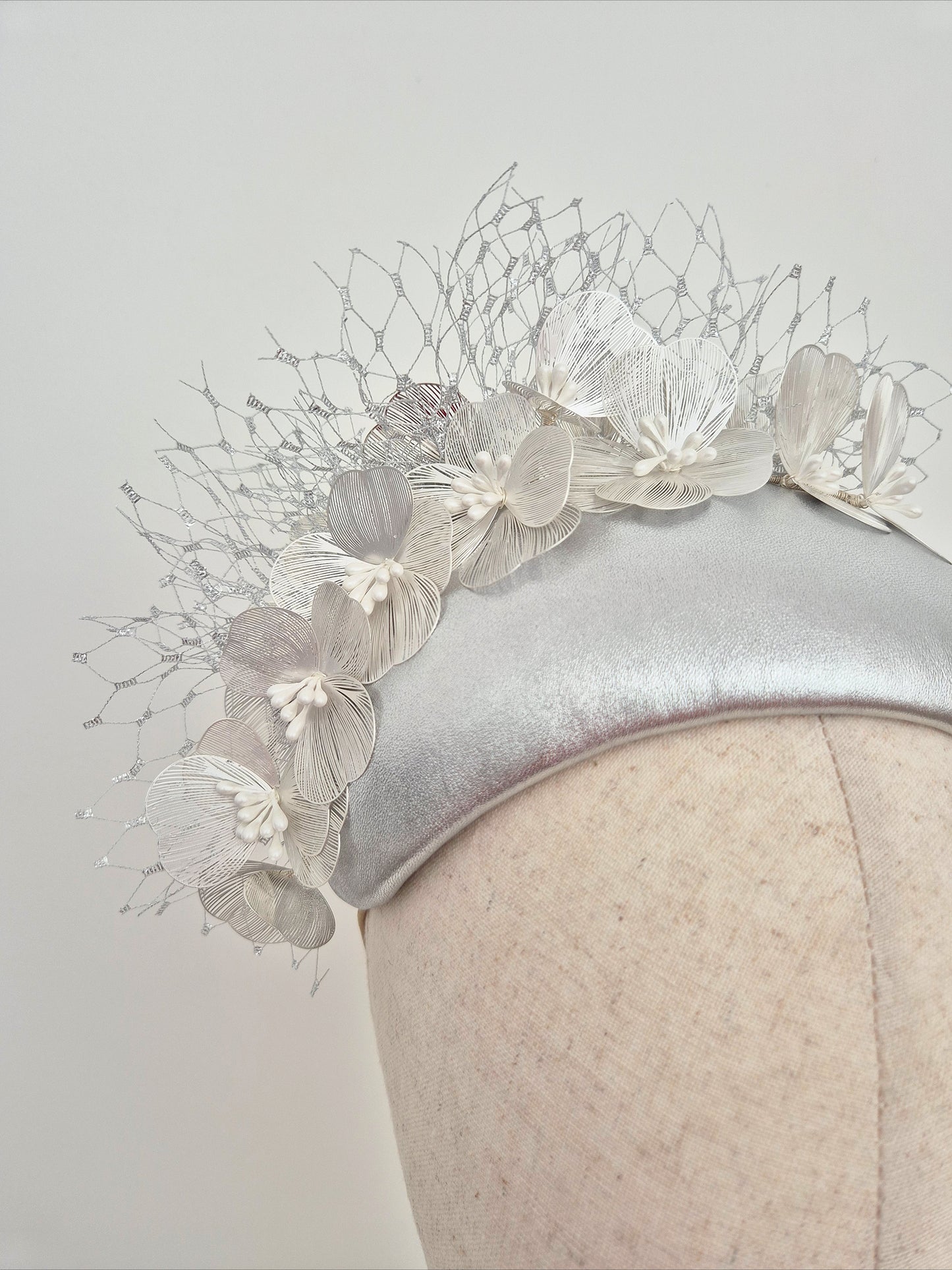 Miss Kinsley. Womens Silver leather bandeau headpiece with silver flowers