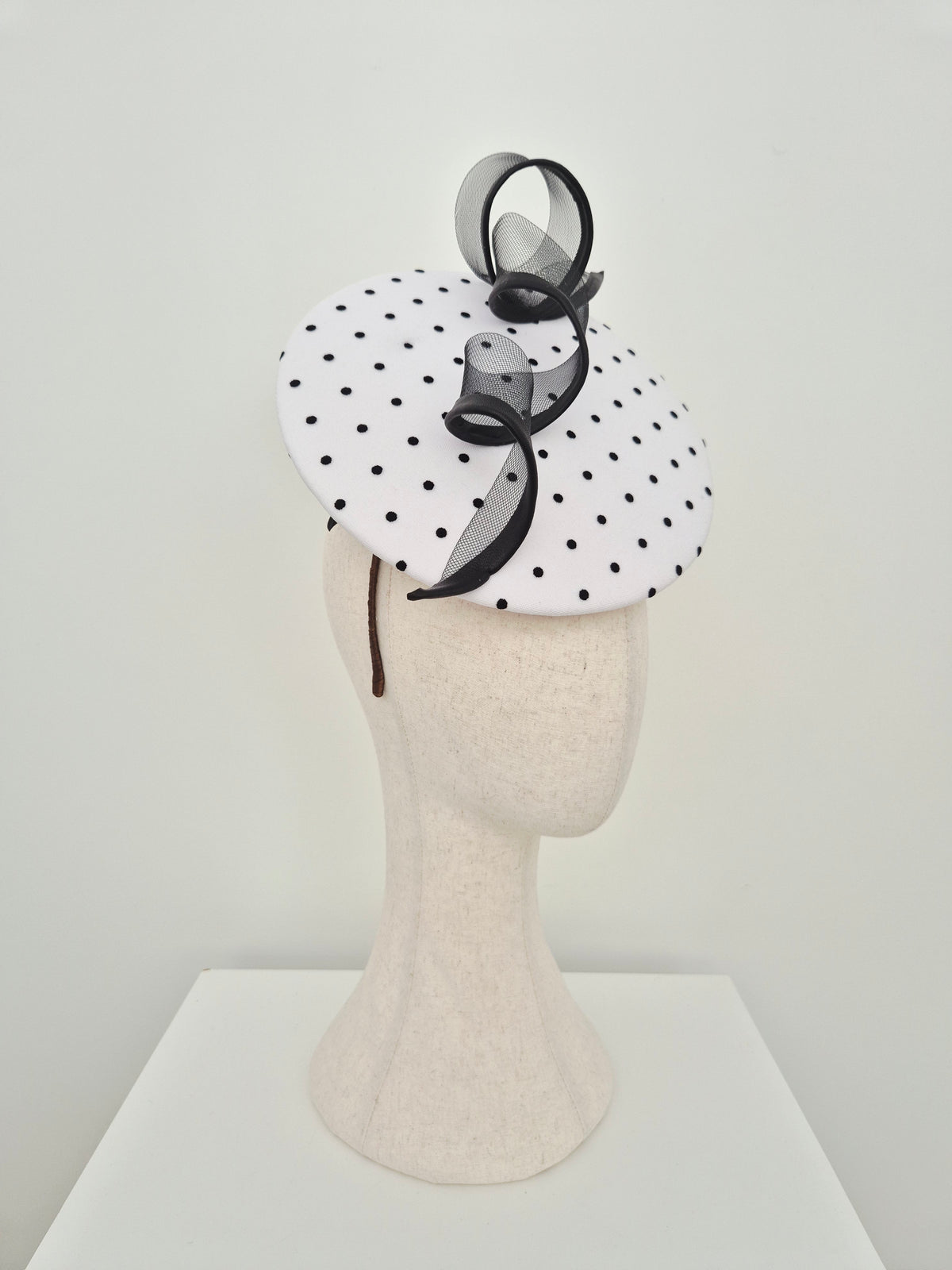 Miss Belle . Womens polka dot floating disk petcher headpiece with swirl