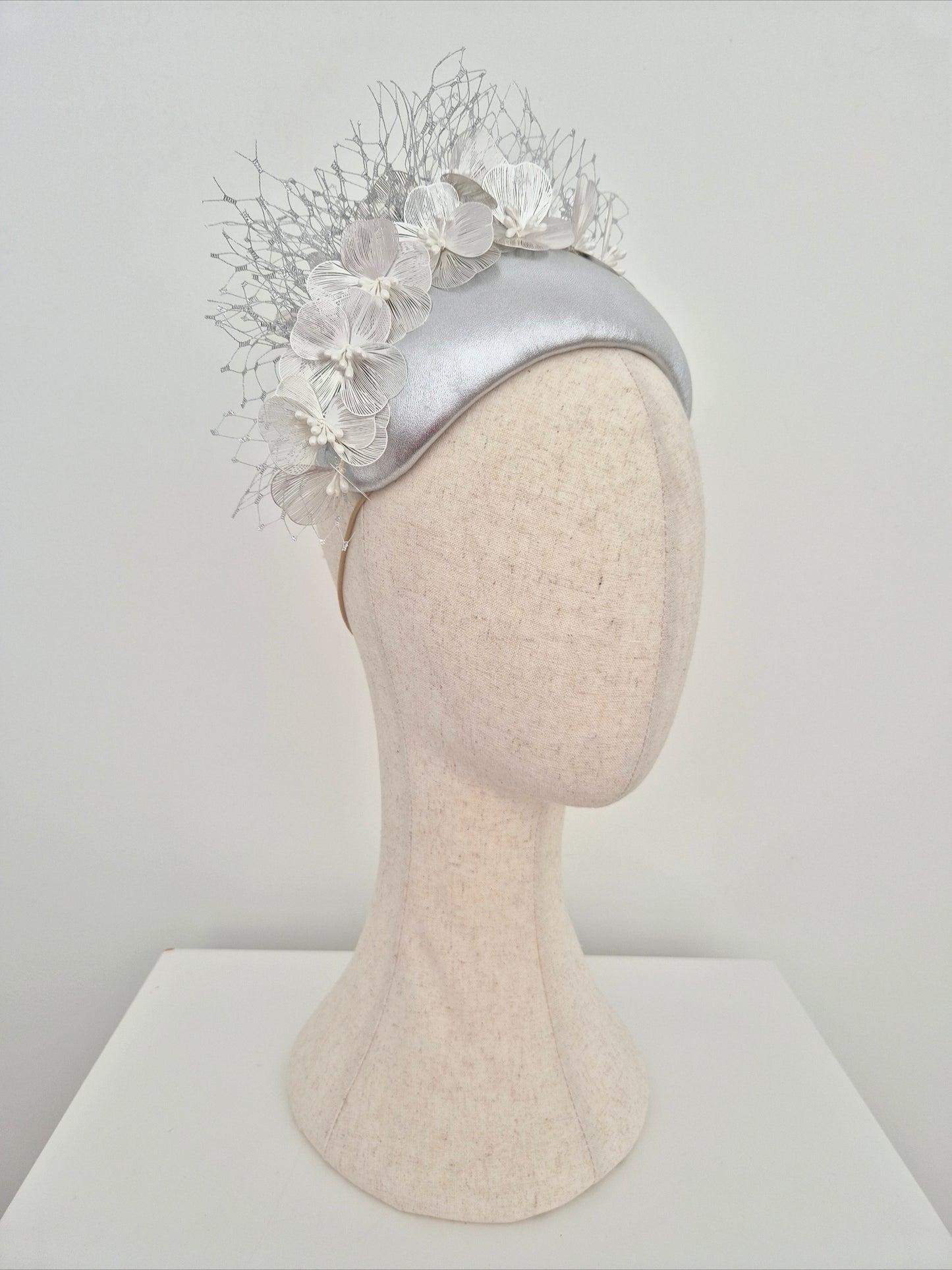 Miss Kinsley. Womens Silver leather bandeau headpiece with silver flowers