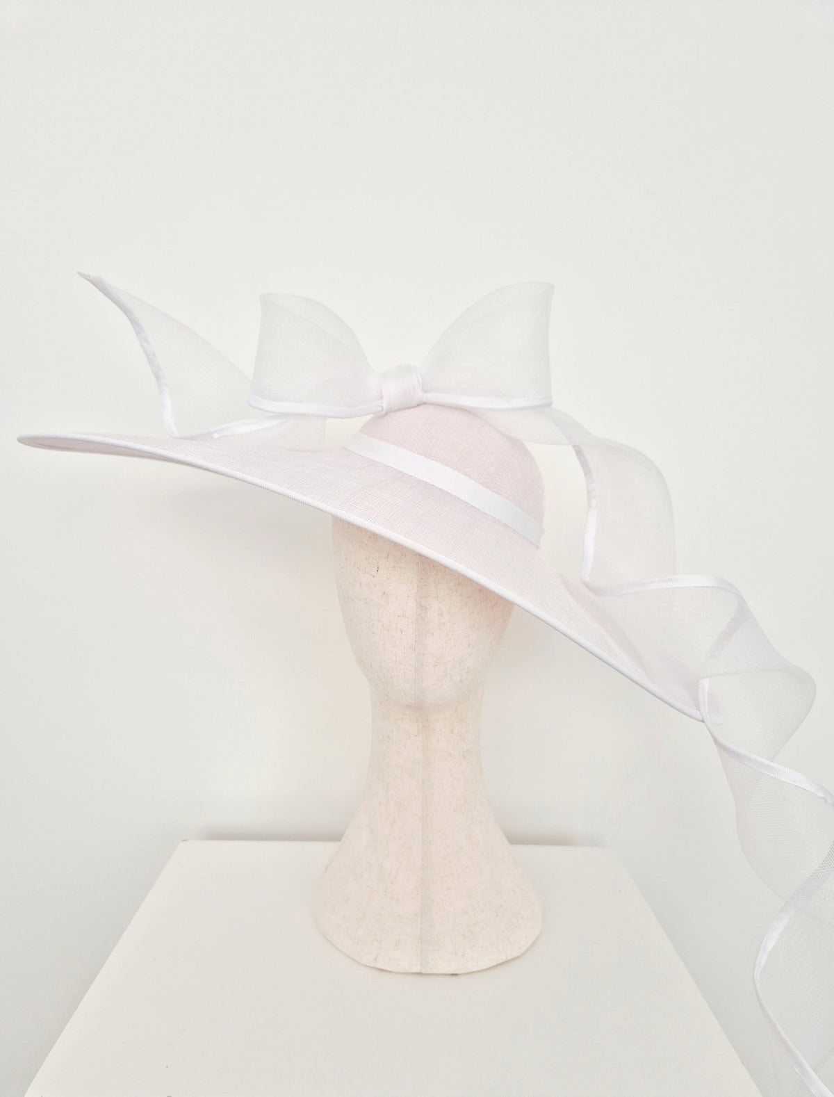 Miss Bonnie. Womens white sinamay straw hat with trailing bow and tails