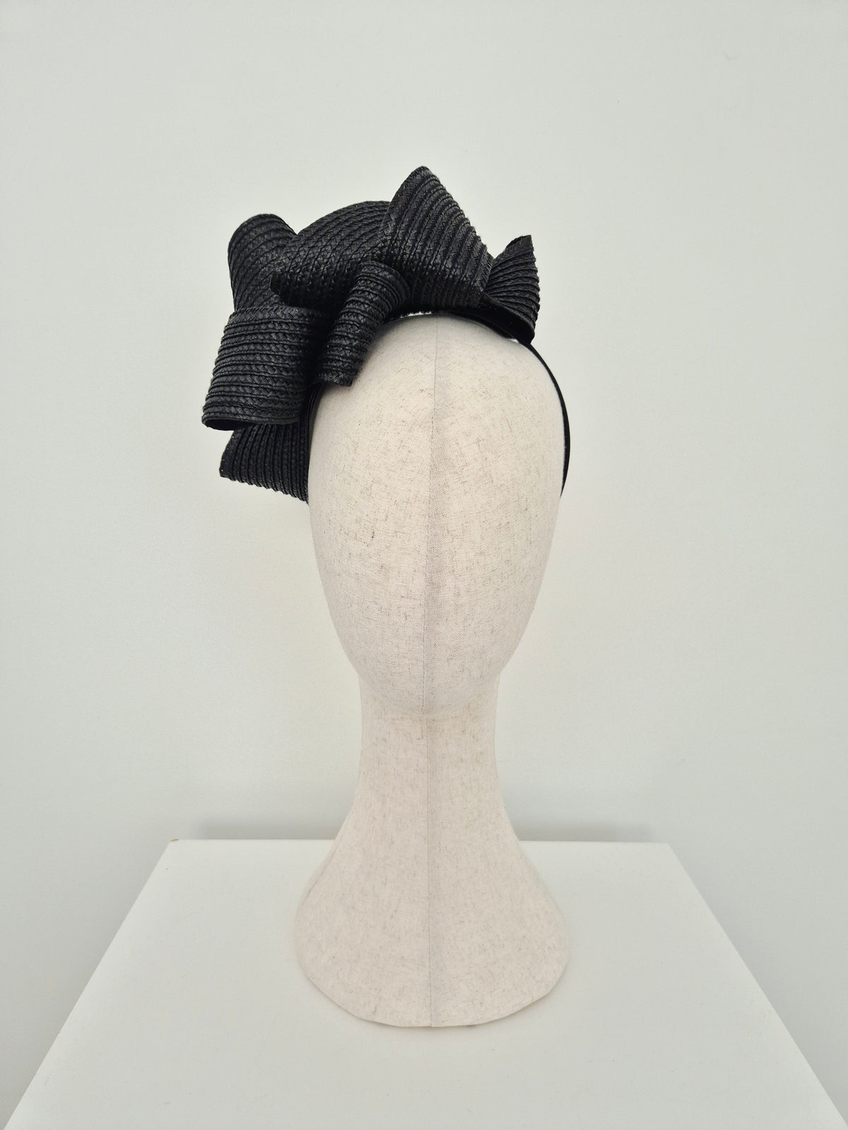 Miss Samantha. Womens braided loop headpiece in Black