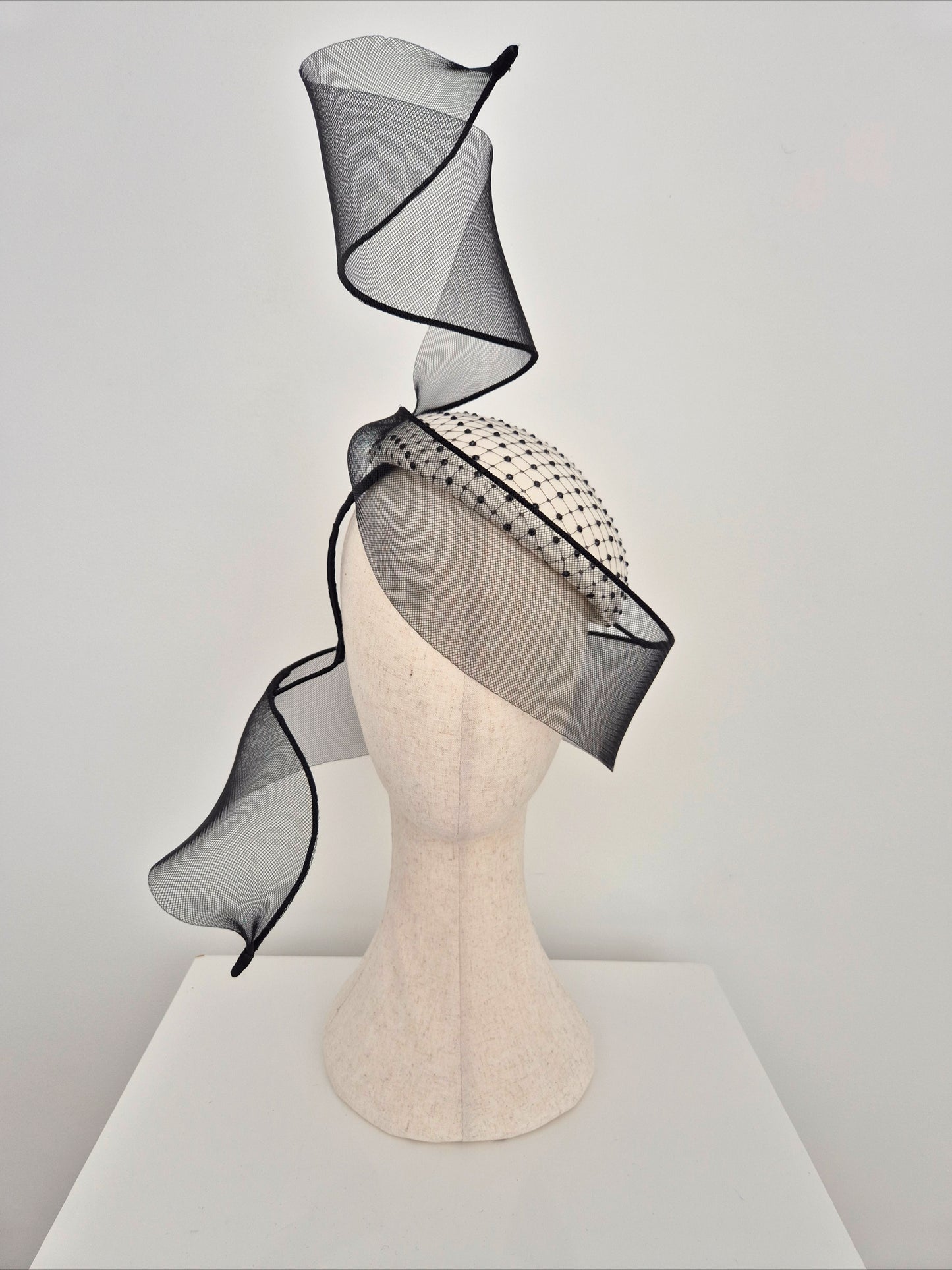 Miss Mabel. Womens Ivory and black felt headpiece with crinoline swirl
