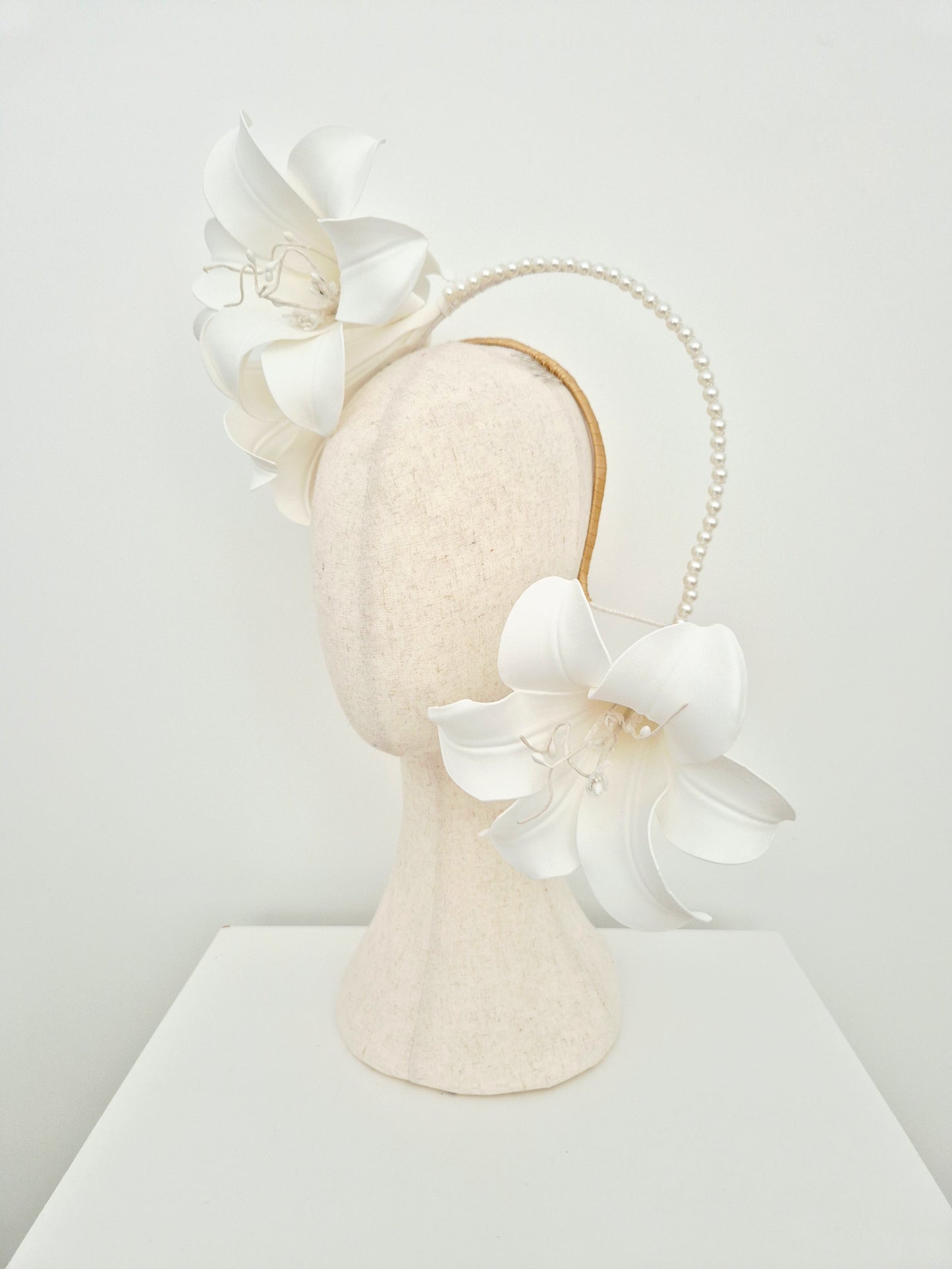 Miss Lilly. Womens white lilly floral cascading headpiece