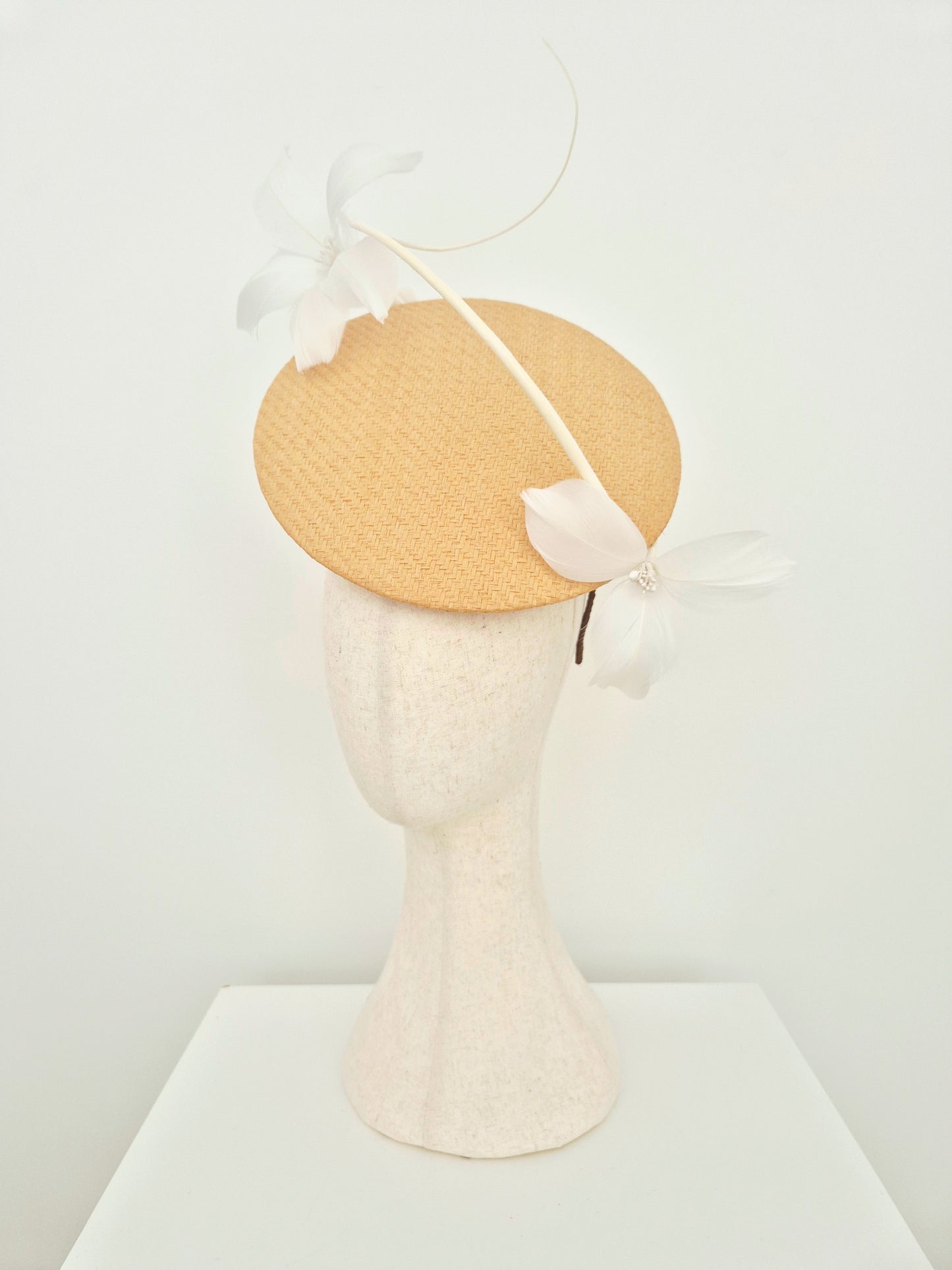 Miss Blair. Womens natural straw disk headpiece with white feather flowers