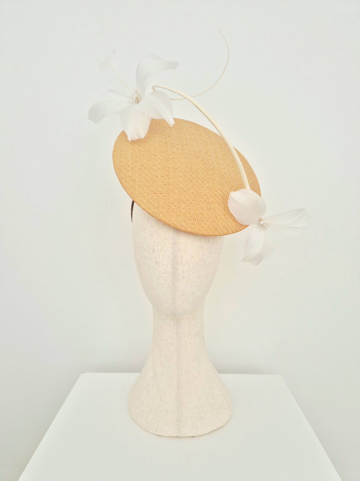 Miss Blair. Womens natural straw disk headpiece with white feather flowers
