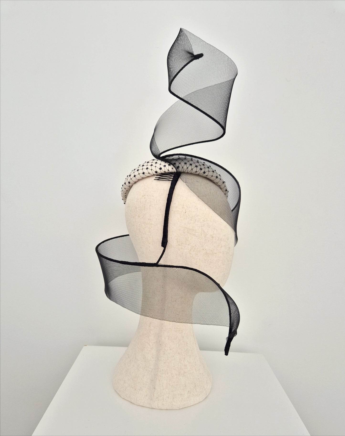 Miss Mabel. Womens Ivory and black felt headpiece with crinoline swirl